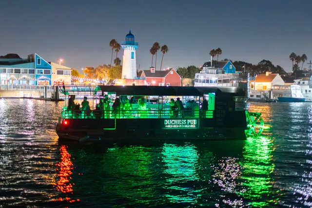 Green lights on The Duchess Pub reflected on the water