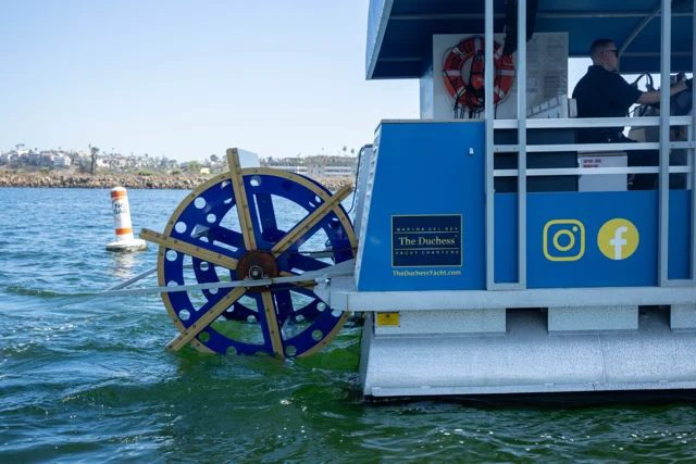 The blue and yellow paddle wheel on The Duchess Pub